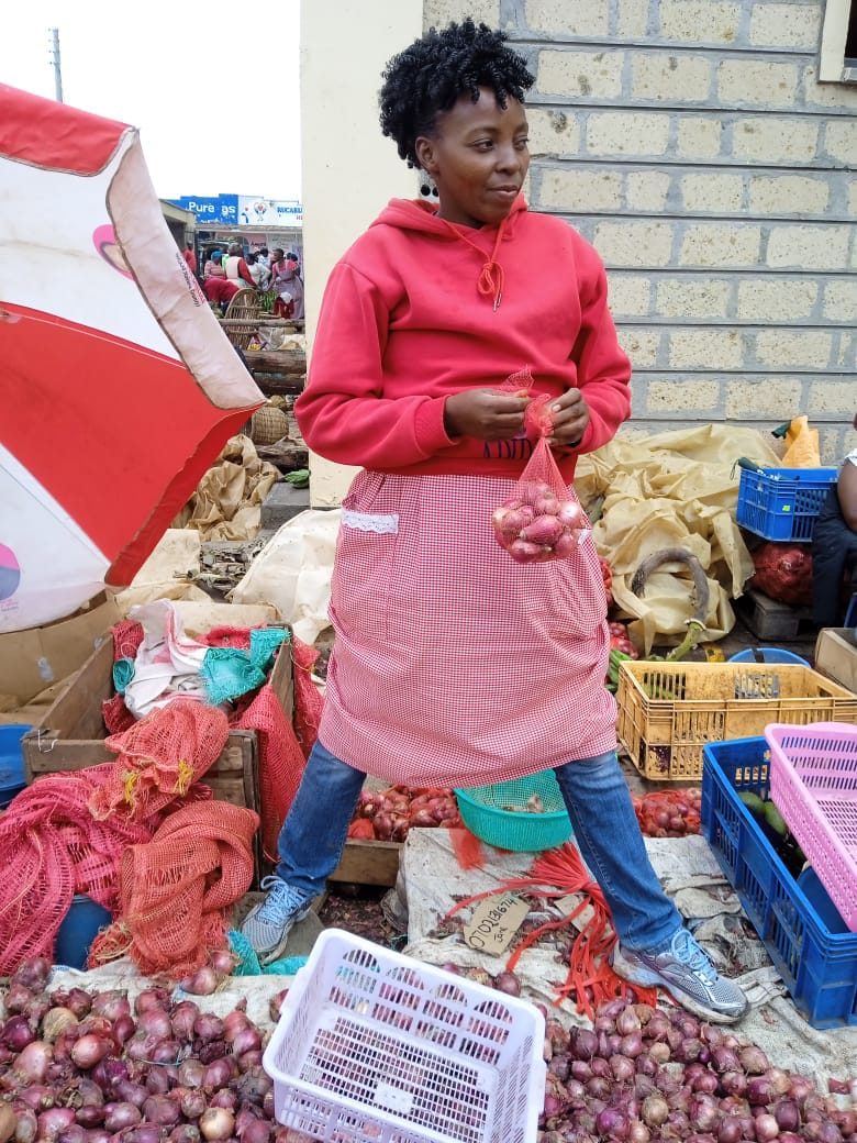 Onion seller packing onions at her stall